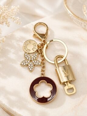 Authentic Louis Vuitton Gold Lock & Key with unbranded Clover Flower Bagcharm